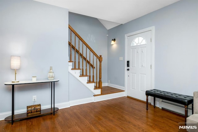 foyer with a baseboard radiator and hardwood / wood-style floors