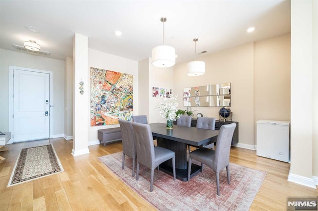 dining area with light wood-type flooring