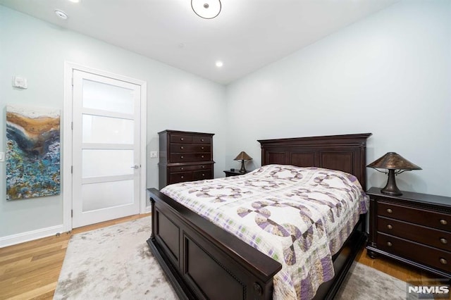 bedroom with light wood-type flooring