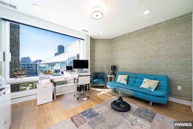 office space with light hardwood / wood-style flooring