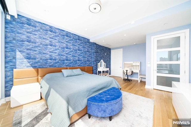 bedroom with wood-type flooring