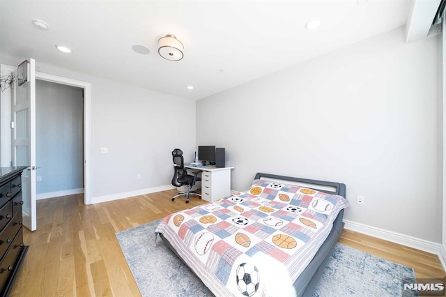 bedroom with light hardwood / wood-style floors