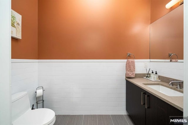 bathroom with toilet and vanity