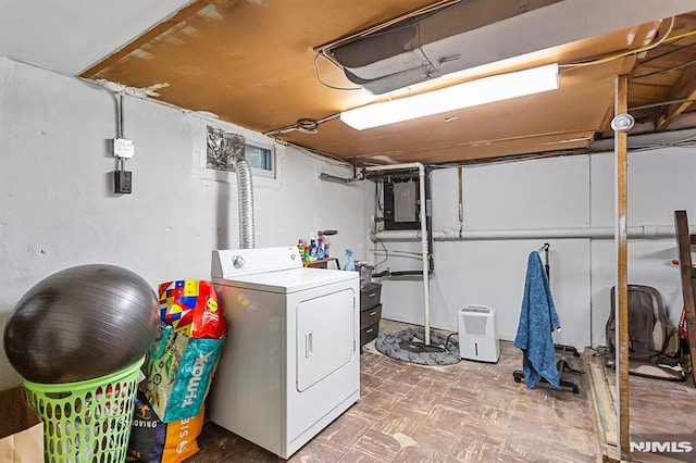 clothes washing area featuring washer / dryer, laundry area, and electric panel