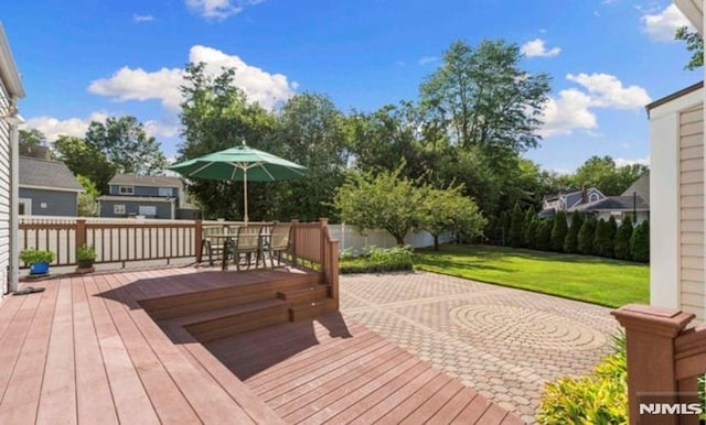 deck featuring a lawn