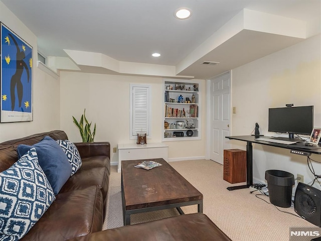 carpeted living room featuring built in features