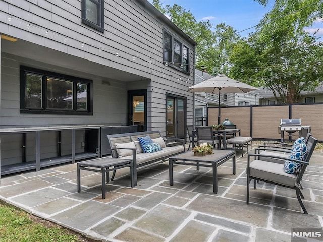 view of patio featuring area for grilling and outdoor lounge area