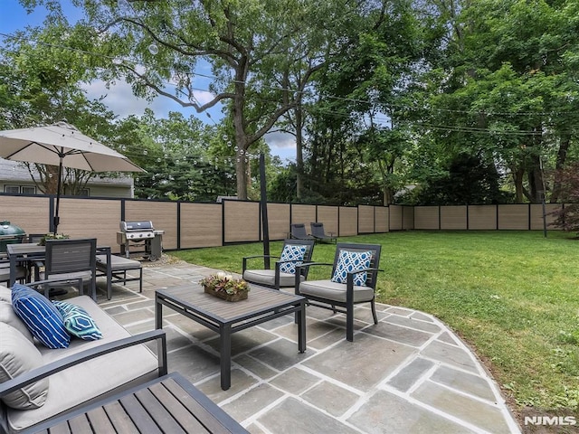 view of patio with an outdoor living space and area for grilling