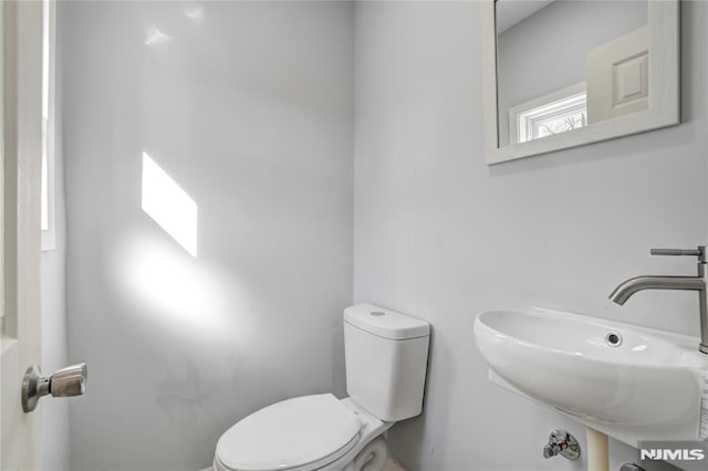 bathroom with sink and toilet