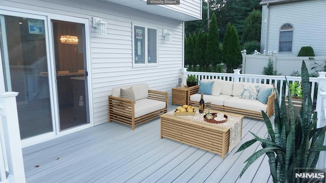 wooden terrace with outdoor lounge area