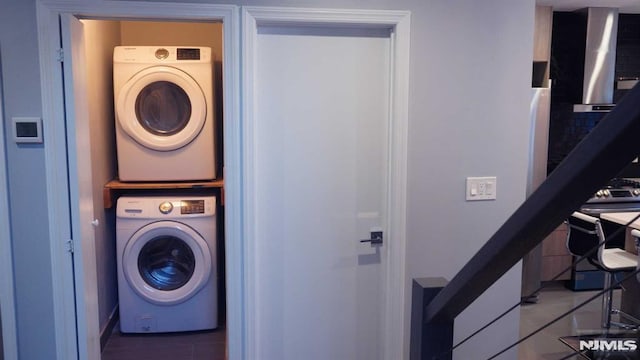 washroom with stacked washer and dryer