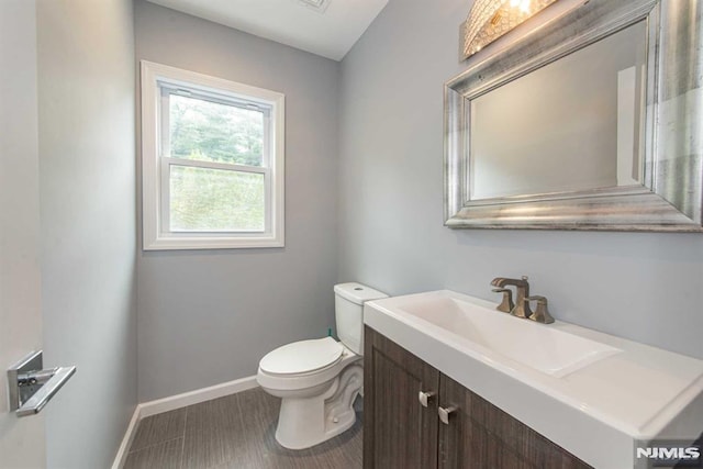 bathroom with toilet and vanity