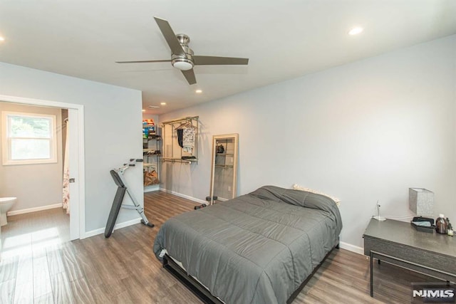 bedroom with ceiling fan and hardwood / wood-style flooring