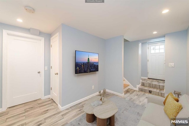 living room with light hardwood / wood-style flooring