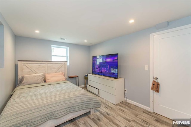 bedroom with light wood-type flooring