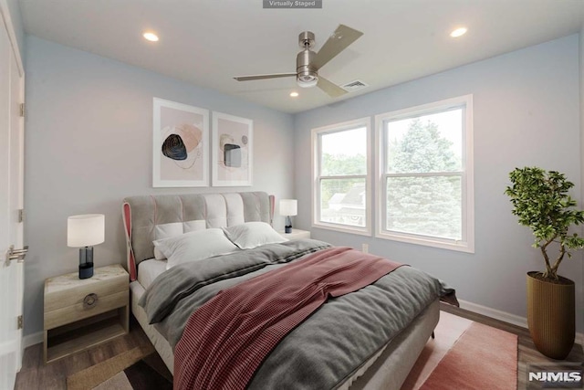 bedroom with hardwood / wood-style flooring and ceiling fan