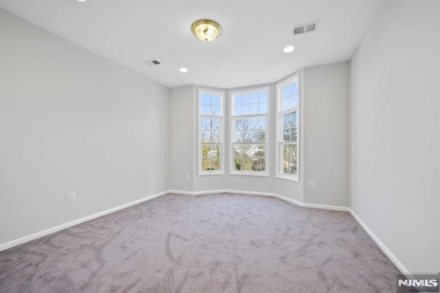 spare room with carpet flooring