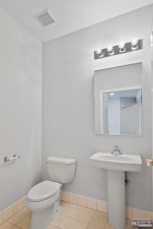 bathroom featuring tile patterned floors and toilet