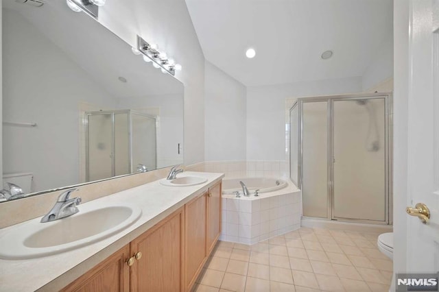 full bathroom with toilet, shower with separate bathtub, tile patterned flooring, and vanity