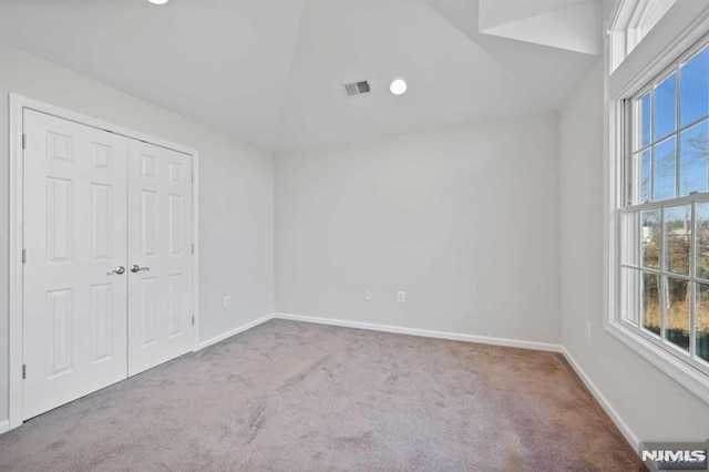 unfurnished bedroom with carpet floors