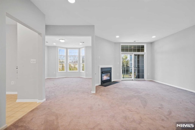 unfurnished living room with carpet floors