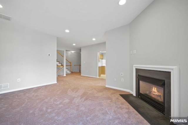 unfurnished living room with carpet