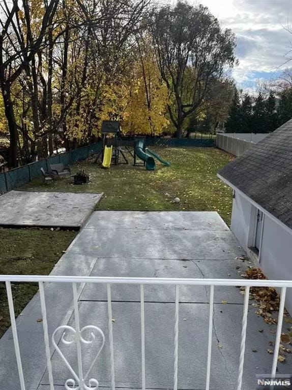 exterior space with a patio and a playground