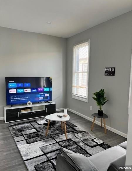 living room featuring dark hardwood / wood-style floors