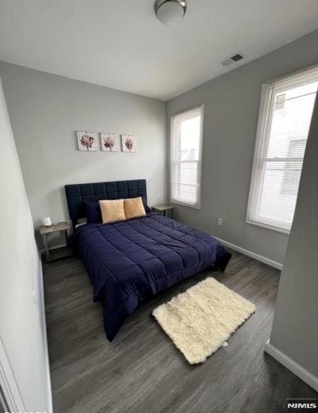 bedroom featuring dark hardwood / wood-style flooring