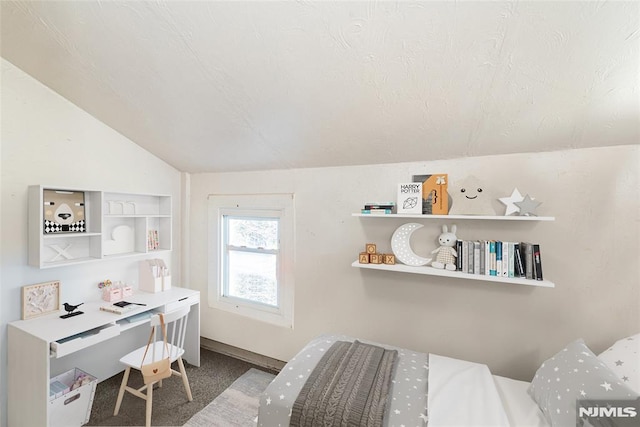 carpeted bedroom featuring vaulted ceiling