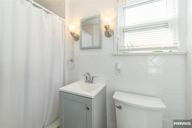 bathroom with toilet and vanity