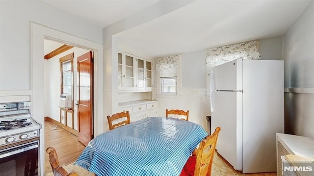 dining area featuring light hardwood / wood-style floors and a wealth of natural light