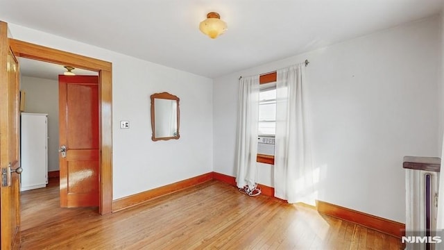 empty room featuring hardwood / wood-style flooring