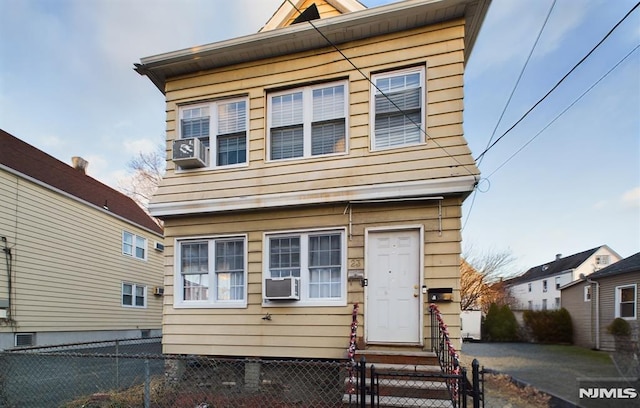 view of front of property featuring cooling unit