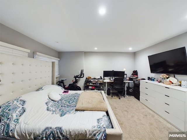 bedroom featuring light carpet