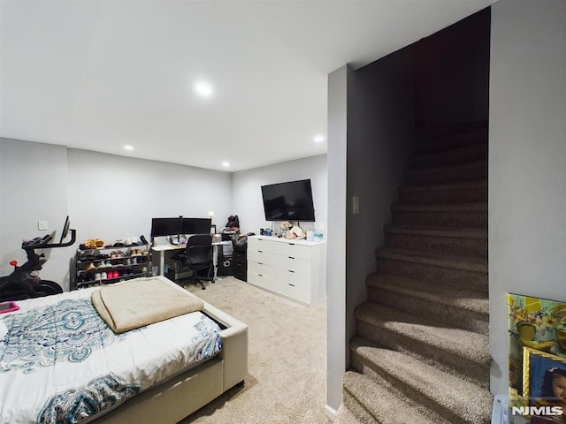 bedroom featuring light colored carpet