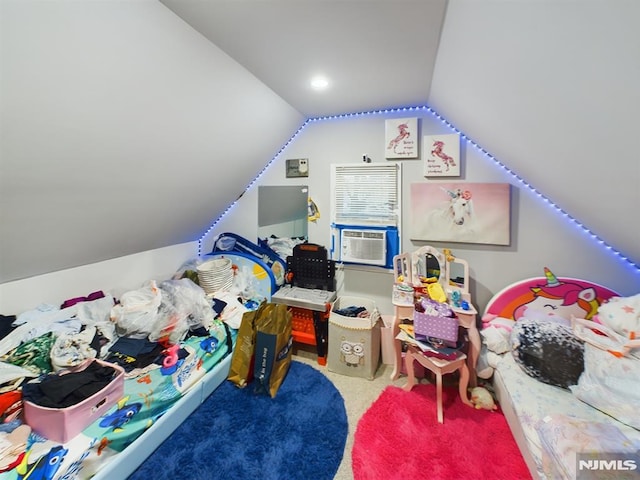 playroom with cooling unit, vaulted ceiling, and carpet floors