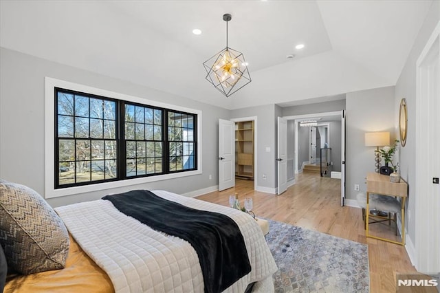 bedroom with light wood-type flooring, baseboards, and recessed lighting