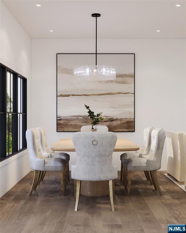 dining area with wood finished floors and recessed lighting