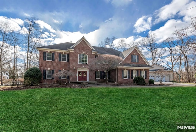 view of front of home with a garage and a front yard