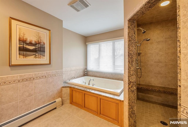 bathroom with tile walls, baseboard heating, tile patterned flooring, and separate shower and tub