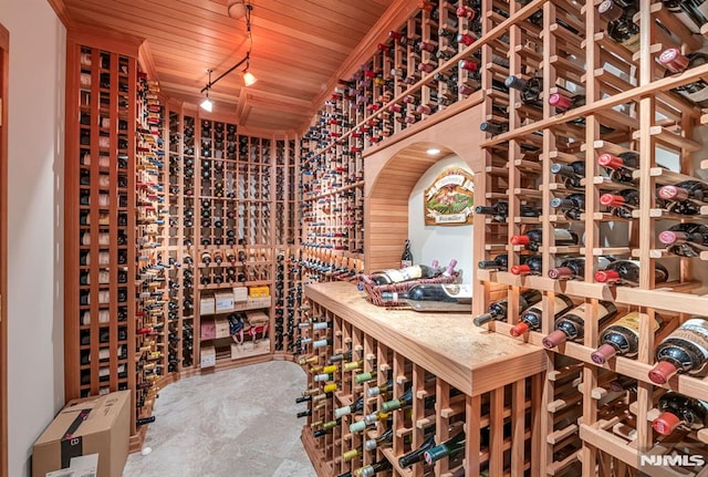 wine area featuring wood ceiling