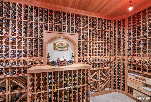 wine room with wooden ceiling