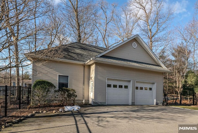 view of side of home with a garage