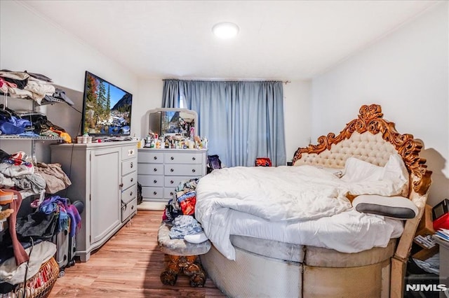 bedroom with light hardwood / wood-style flooring