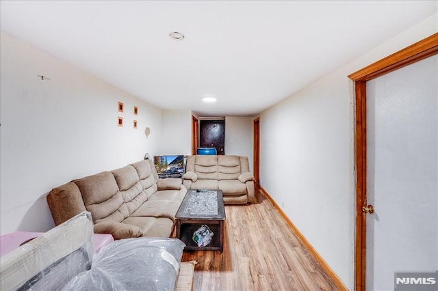 living room with light hardwood / wood-style floors