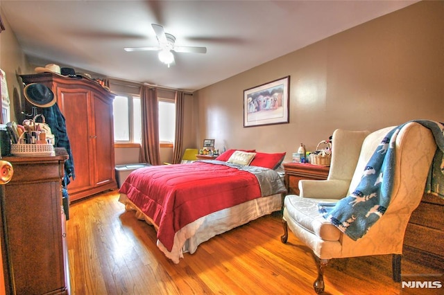 bedroom featuring ceiling fan and light wood-type flooring