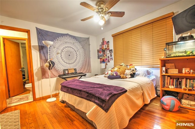 bedroom with ceiling fan and wood-type flooring