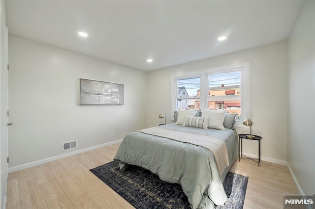 bedroom with light hardwood / wood-style flooring