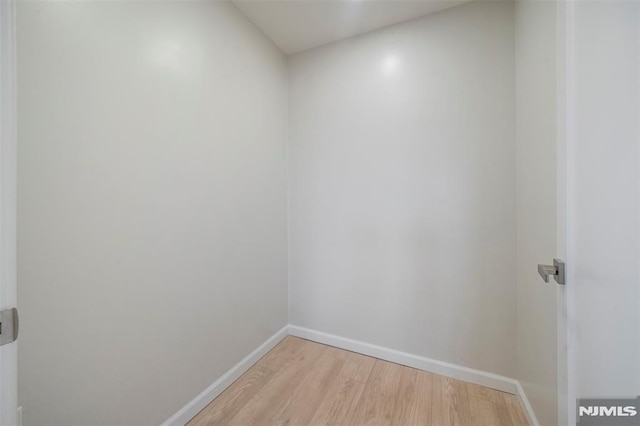 unfurnished room with light hardwood / wood-style floors